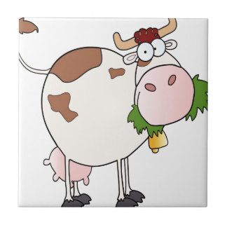 Cartoon cow eating grass ceramic tile