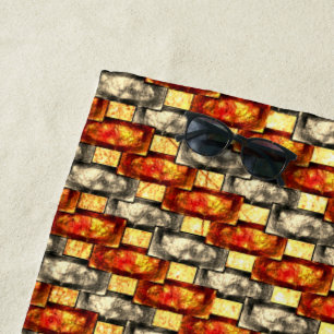 Carved rectangular pieces lined in red and beige beach towel