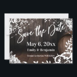 Casual Handwriting Lights Lace & White Flowers Save The Date<br><div class="desc">This card is covered in an image that includes part of a wooden barrel against a dark rustic brown wall. Perfect for your whiskey, wine, brewery, winery or other rustic-themed wedding celebration. This background image was draped in graphics depicting strings of twinkling lights, white watercolor floral sprays, and lace accents....</div>