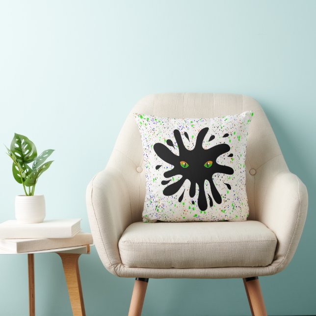 Cat Eyes looking out a Black Blob Cushion (Chair)