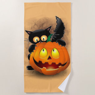 Cat Fun Halloween Character biting a Pumpkin  Beach Towel