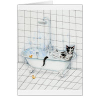 Cat reading newspaper in the bathtub
