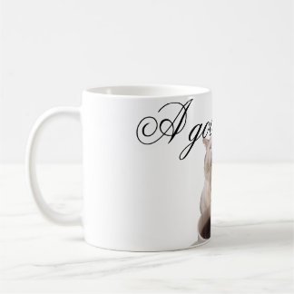 Cat sipping coffee mug