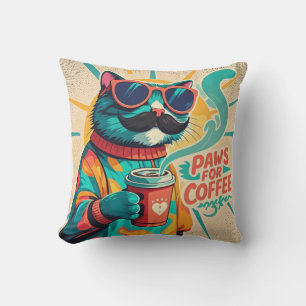 Cat wearing oversized sunglasses, holding a coffee cushion