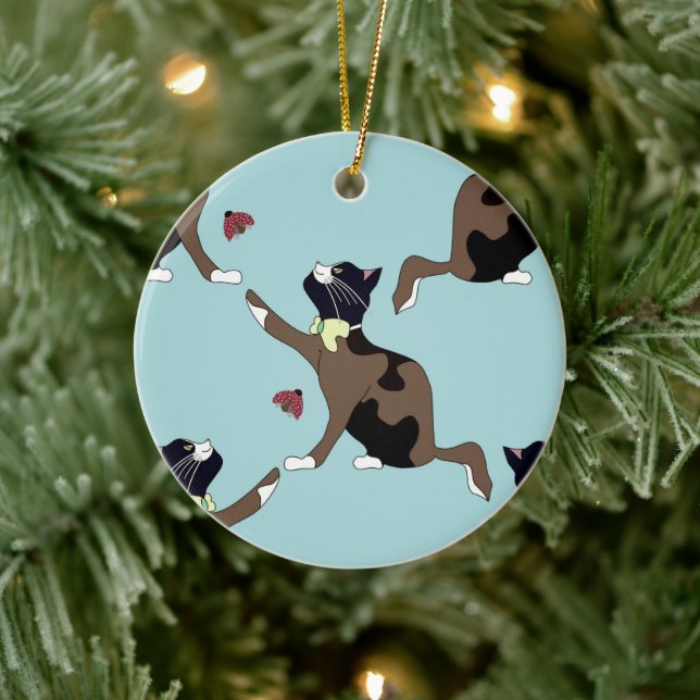 Cat with a bow catches a ladybug. ceramic ornament (Tree)