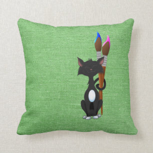 Cat With Paint Brushes On Green Cushion