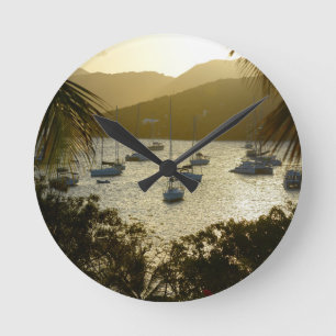 Catamarans and sailboats round clock