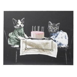 Cats celebrating a birthday with cake and candles notepad