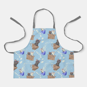 Cats in box and milk drops on blue apron