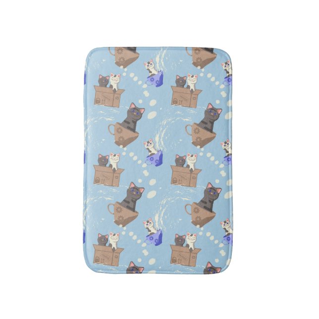 Cats in box and milk drops on blue bath mat (Front Vertical)