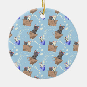 Cats in box and milk drops on blue ceramic ornament