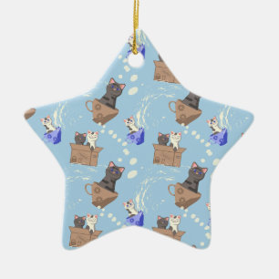 Cats in box and milk drops on blue ceramic ornament