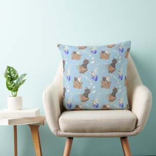 Cats in box and milk drops on blue cushion