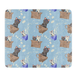 Cats in box and milk drops on blue cutting board