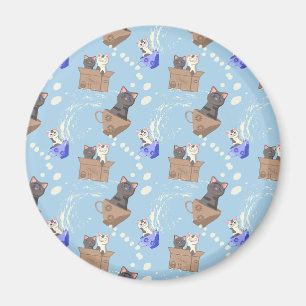 Cats in box and milk drops on blue magnet