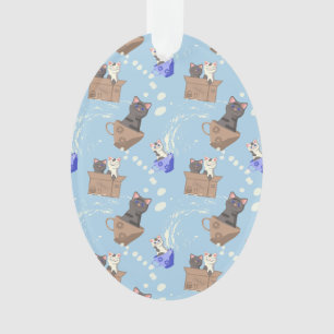 Cats in box and milk drops on blue ornament