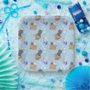 Cats in box and milk drops on blue paper plate