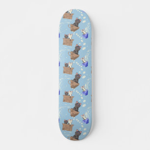 Cats in box and milk drops on blue skateboard