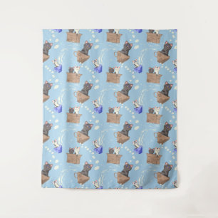 Cats in box and milk drops on blue tapestry