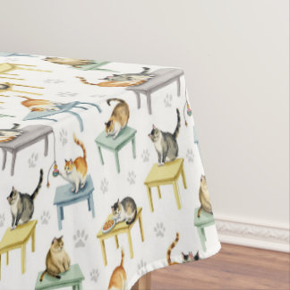 Cats on a table tablecloth