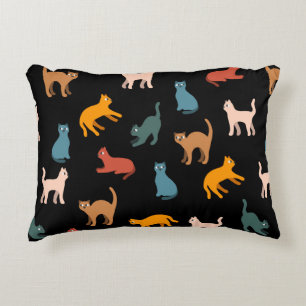 Cats on the black decorative cushion