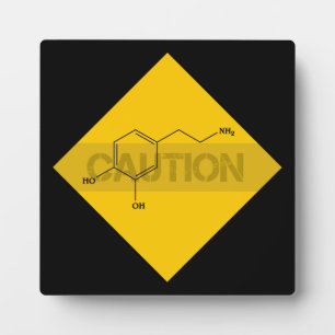 Caution: Dopamine Plaque