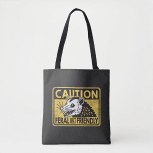 Caution feral but friendly tote bag