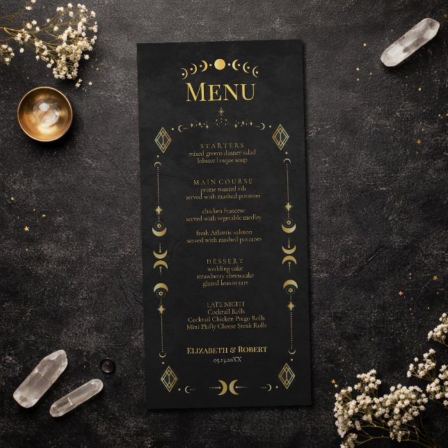 Celestial Gothic Black and Gold Wedding Menu Card (Celestial Gothic Black and Gold Wedding Menu Card on an elegant dark table with dry flowers)