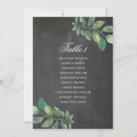 Chalkboard wedding seating chart. Green leaves