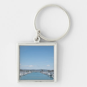 channel in harbour on a sunny day with blue sky key ring