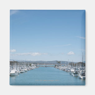 channel in harbour on a sunny day with blue sky magnet