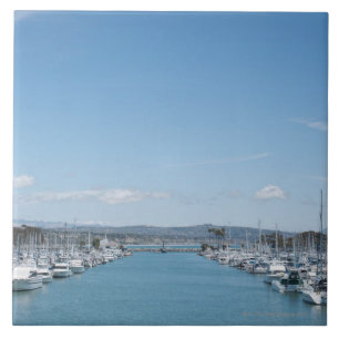 channel in harbour on a sunny day with blue sky tile