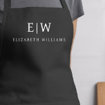 Charcoal Grey Modern Minimalist Monogram Name Apron<br><div class="desc">Elevate your culinary experience with our Classic Elegant Modern Minimalist Monogram Name Cooking Apron. This kitchen essential seamlessly merges timeless elegance with contemporary minimalism. Crafted with precision, this apron is not just a practical accessory but also a statement of personal style. The customisable monogram and name option allows you to...</div>