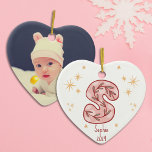 Charming Pink Star Pattern Ceramic Ornament<br><div class="desc">Celebrate your baby girl's first Christmas with a delightful pink star design adorned with golden accents. Personalise it with her name and the year, creating a keepsake full of love. Add a cherished photo on the back to capture a precious memory. Let it sparkle and shine, bringing warmth to any...</div>