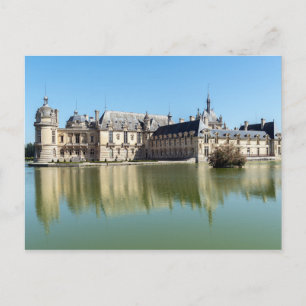Chateau de Chantilly with reflection in the lake Postcard