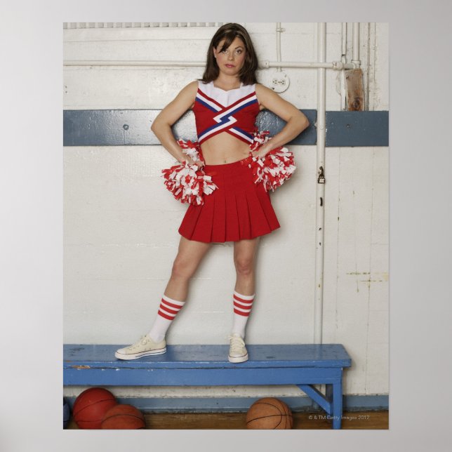 Cheerleader standing on bench near basketballs, poster (Front)