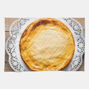 Cheesecake on rustic wood cake top. tea towel