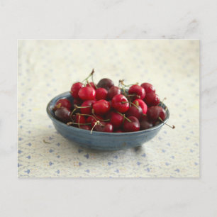 Cherries in a blue bowl postcard