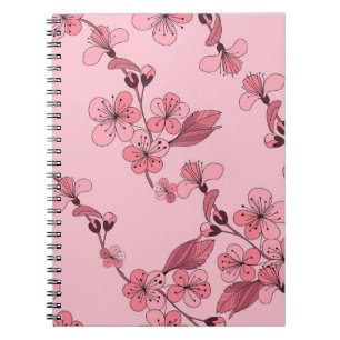 Cherry blossom in pink colour on white background. notebook