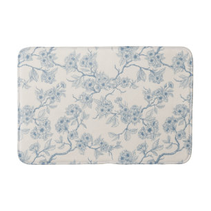 Chery blossom branches in blue and off white bath mat