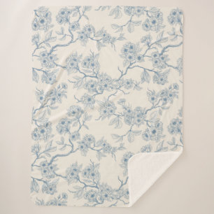 Chery blossom branches in blue and off white sherpa blanket