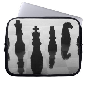 Chess pieces on chess board in black and white laptop sleeve