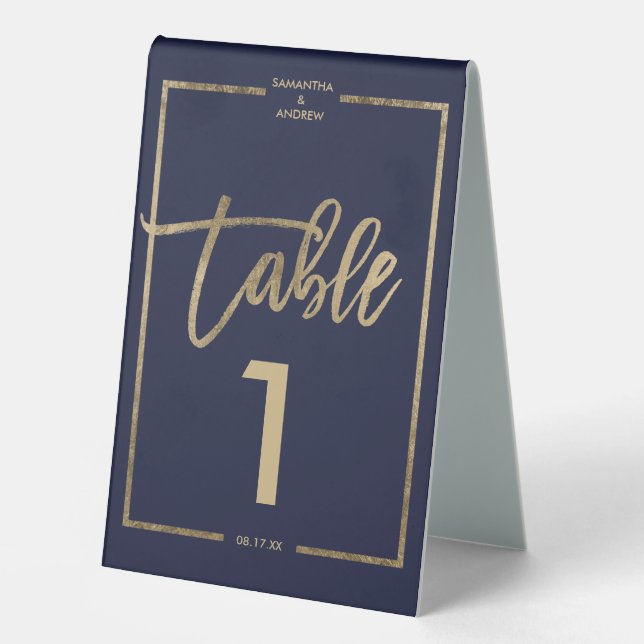 Chic gold frame script navy blue table number (Front)