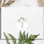 Chic Greenery Wedding Monogram Envelope Seal/Favou Classic Round Sticker<br><div class="desc">Add an elegant detail to your wedding envelopes and/or wedding favours with this elegant greenery monogram label sticker. Stylish yet minimal and simple design with delicate watercolor Eucalyptus greenery branches with leaves showcasing the initials of the couple and an extra text line, ideal for a date or short message like...</div>