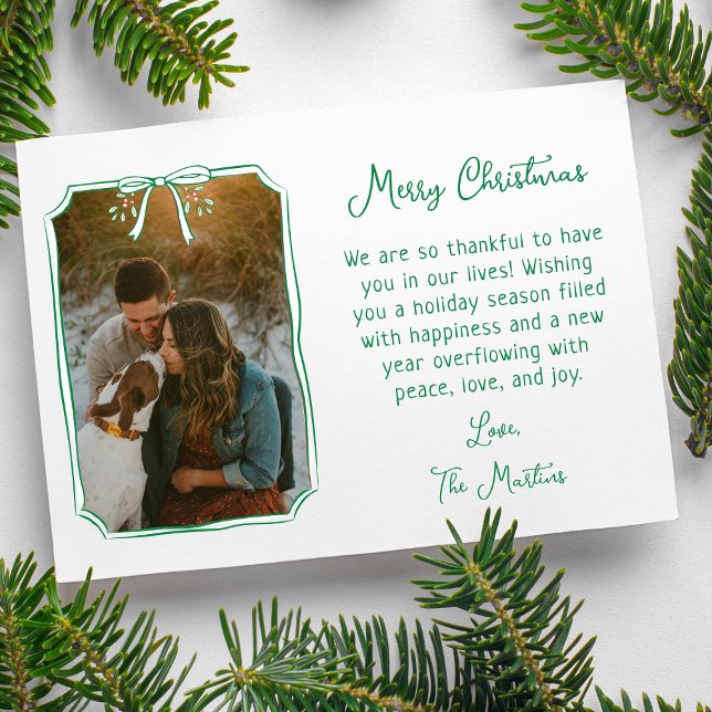 Chic Mistletoe & Bow Custom Family Photo Christmas Holiday Card (Warm hearts with a festive card featuring a hand-drawn holiday bow and your cherished memories.)