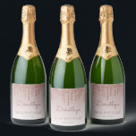 Chic Rose Gold Glitter Drip 90th Birthday Party Sparkling Wine Label<br><div class="desc">These chic,  feminine ninetieth birthday sparkling wine bottle labels feature a sparkly rose gold faux glitter drip border and rose gold ombre background. Personalise them with her name in dark rose handwriting script,  with her birthday and date below in sans serif font.</div>