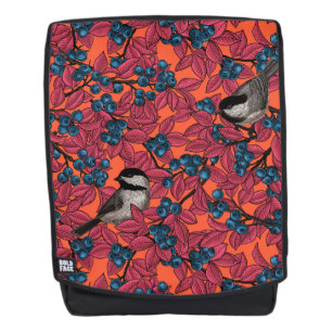 Chickadee birds on blueberry branches on orange backpack
