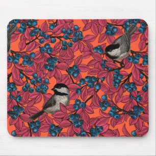 Chickadee birds on blueberry branches on orange mouse pad