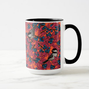 Chickadee birds on blueberry branches on orange mug