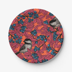 Chickadee birds on blueberry branches on orange paper plate
